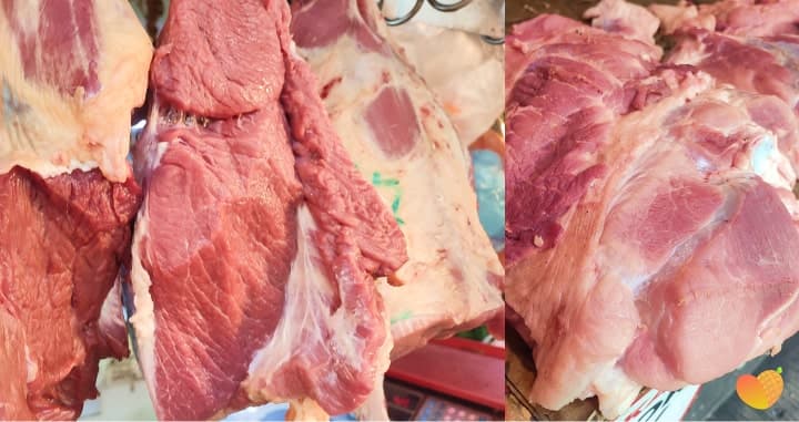Pork cuts hanging at the Pamilya Market meat stall