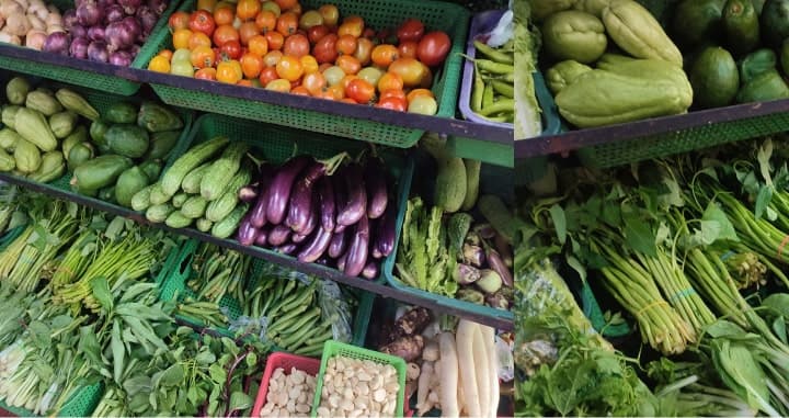 Vegetables in green crates at the vegetable stall